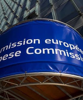 Signage displaying 'Commission européenne' and 'European Commission' on a building facade. - Olive Oil Times