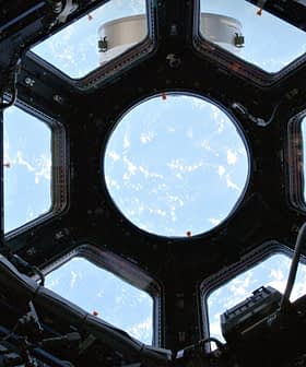 Interior view of the International Space Station's Cupola with a circular window showing Earth. - Olive Oil Times