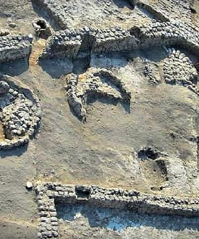 Aerial view of an archaeological site featuring various stone structures and formations. - Olive Oil Times