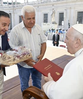 Two men presenting gifts to Pope Francis during a meeting at the Vatican. - Olive Oil Times