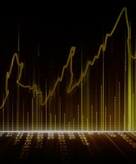 Line graph with upward trends displayed in yellow against a dark background. - Olive Oil Times