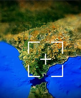 Aerial image showing a coastal region with land and water features in view. - Olive Oil Times