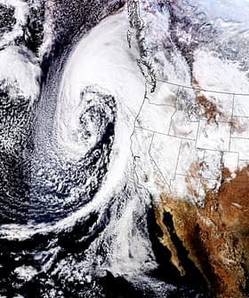 Satellite image showing a weather system swirling off the west coast of North America with cloud formations. - Olive Oil Times