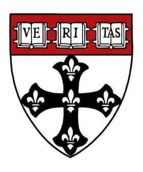 Escudo de armas de la Universidad de Harvard con una cruz negra y la palabra "Veritas". Olive Oil Times