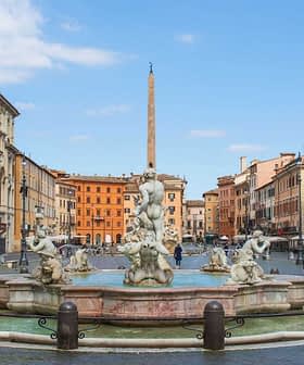 Fontein met sculpturen en een obelisk in het midden van Piazza Navona in Rome. Olive Oil Times