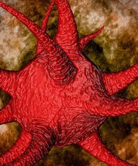 Ilustración de un virus rojo con protuberancias puntiagudas sobre un fondo texturizado. Olive Oil Times