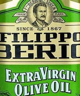 Bouteille d'huile d'olive extra vierge Filippo Berio avec une étiquette verte et un portrait d'homme. - Olive Oil Times