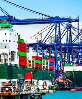 Deux grands porte-conteneurs amarrés dans un port avec des conteneurs d'expédition colorés empilés dessus. Olive Oil Times