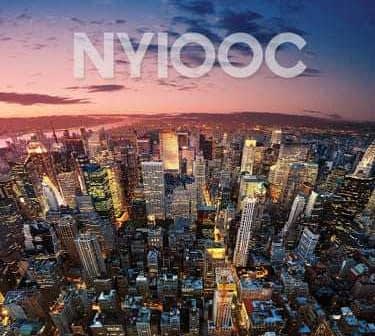 Aerial view of New York City skyline during sunset with vibrant colors in the sky. - Olive Oil Times