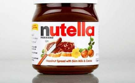 Jar of Nutella hazelnut spread with a label indicating ingredients and brand. - Olive Oil Times