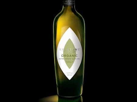 Green glass bottle of Rylstone organic extra virgin olive oil with a distinctive label design. - Olive Oil Times