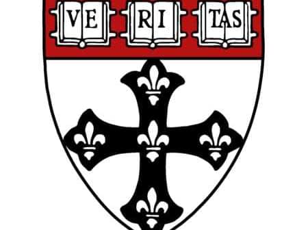 Coat of arms of Harvard University featuring a black cross and the word 'Veritas'. - Olive Oil Times