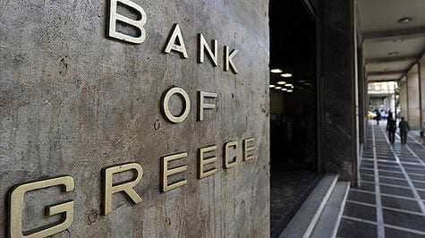 Sign with the words 'Bank of Greece' displayed on a building exterior. - Olive Oil Times
