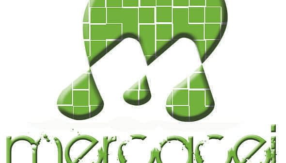 Logo of Mercacei Magazine featuring a stylized green letter M and the magazine name in lowercase. - Olive Oil Times