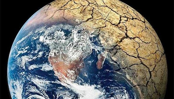 Image of Earth showing cracked land surface and visible water bodies from space. - Olive Oil Times