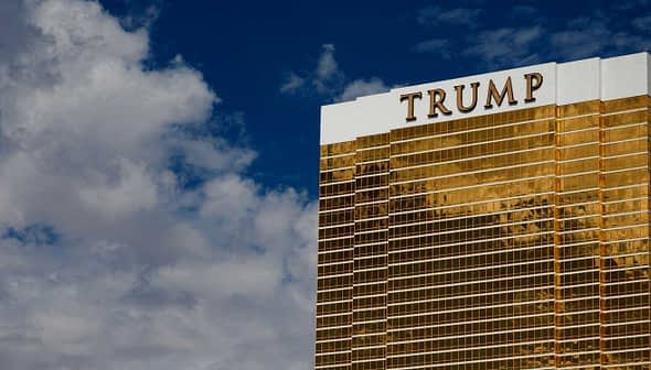Trump International Hotel and Tower, a tall golden building with the name 'TRUMP' prominently displayed on top. - Olive Oil Times