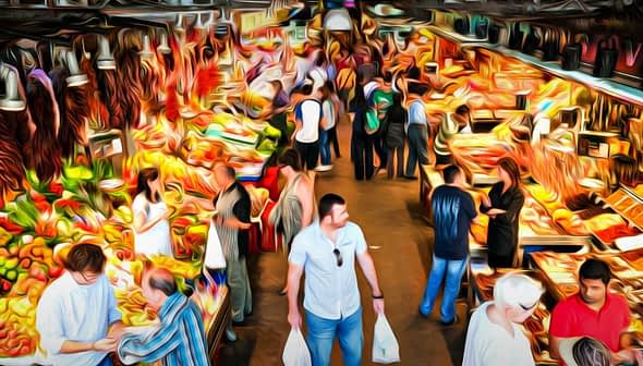 A vibrant market scene featuring various fruits, vegetables, and people shopping. - Olive Oil Times