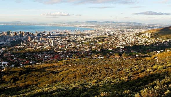 Aerial view of Cape Town with the coastline and mountains in the background. - Olive Oil Times