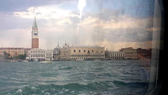 Scenic view of Venice's architecture from a vaporetto on the water. - Olive Oil Times