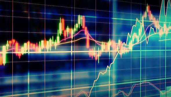Colorful stock market chart displaying various graph lines and data trends on a digital screen. - Olive Oil Times