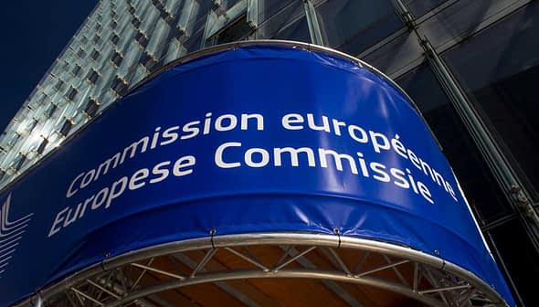 Signage displaying 'Commission européenne' and 'European Commission' on a building facade. - Olive Oil Times