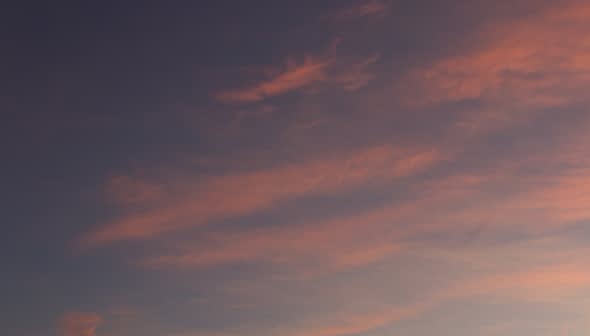 A sky filled with colorful clouds during sunset, featuring shades of pink and blue. - Olive Oil Times