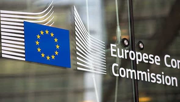 Signage of the European Commission featuring the EU flag and the organization's name. - Olive Oil Times