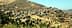 卡比利亞地區一個山村的全景，有房屋和農田。 - Olive Oil Times