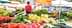 Assorted fresh vegetables including tomatoes, peppers, and cucumbers displayed at a market stall. - Olive Oil Times