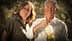 A man and a woman standing together, with the man holding an olive oil bottle in his hand. - Olive Oil Times