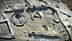 Aerial view of an archaeological site featuring various stone structures and formations. - Olive Oil Times