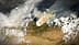 Vista de satélite mostrando fumaça subindo de um incêndio florestal em uma paisagem com nuvens e terreno visíveis. - Olive Oil Times