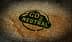 Green CO2 neutral stamp printed on a textured fabric background. - Olive Oil Times