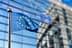 European Union flag with twelve stars on a blue background, waving in the wind. - Olive Oil Times