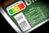 Rótulo Nutri-Score exibindo as letras A, B, C, D, E na embalagem do alimento com um código de barras. - Olive Oil Times
