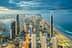 Aerial view of Gold Coast city skyline with high-rise buildings and coastline at dusk. - Olive Oil Times
