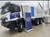 Iveco truck with World Food Programme branding, parked next to a sign for Food for Gaza initiative. - Olive Oil Times