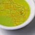 Map of Los Angeles displayed in a small white dish filled with olive oil. - Olive Oil Times