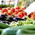 A selection of fresh vegetables including cucumbers, eggplants, and green beans displayed at a market. - Olive Oil Times