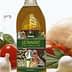 Bottle of Leonardo olive oil with a decorative label featuring vegetables and herbs. - Olive Oil Times