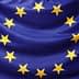 Flag of the European Union featuring a blue background with a circle of twelve yellow stars. - Olive Oil Times