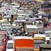A congested urban road filled with various vehicles in a traffic jam. - Olive Oil Times