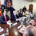 A group of government officials seated around a conference table during a meeting. - Olive Oil Times
