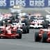 Several Formula 1 race cars competing on a track during a race event. - Olive Oil Times