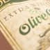 Close-up of an olive oil bottle label featuring the text 'Extra Virgin Olive Oil'. - Olive Oil Times