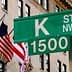 Green street sign for K Street NW with the number 1500 in Washington D.C. - Olive Oil Times