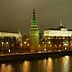 Night view of the Moscow Kremlin with illuminated towers and buildings along the river. - Olive Oil Times