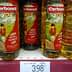Three bottles of Carbonell olive oil displayed on a store shelf with a price tag below. - Olive Oil Times