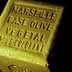 A rectangular block of Marseille soap labeled 'Base Olive Vegetal Sans Colorant'. - Olive Oil Times