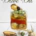Book cover for 'Cooking Techniques with Olive Oil' featuring a glass container with layered ingredients and herbs. - Olive Oil Times
